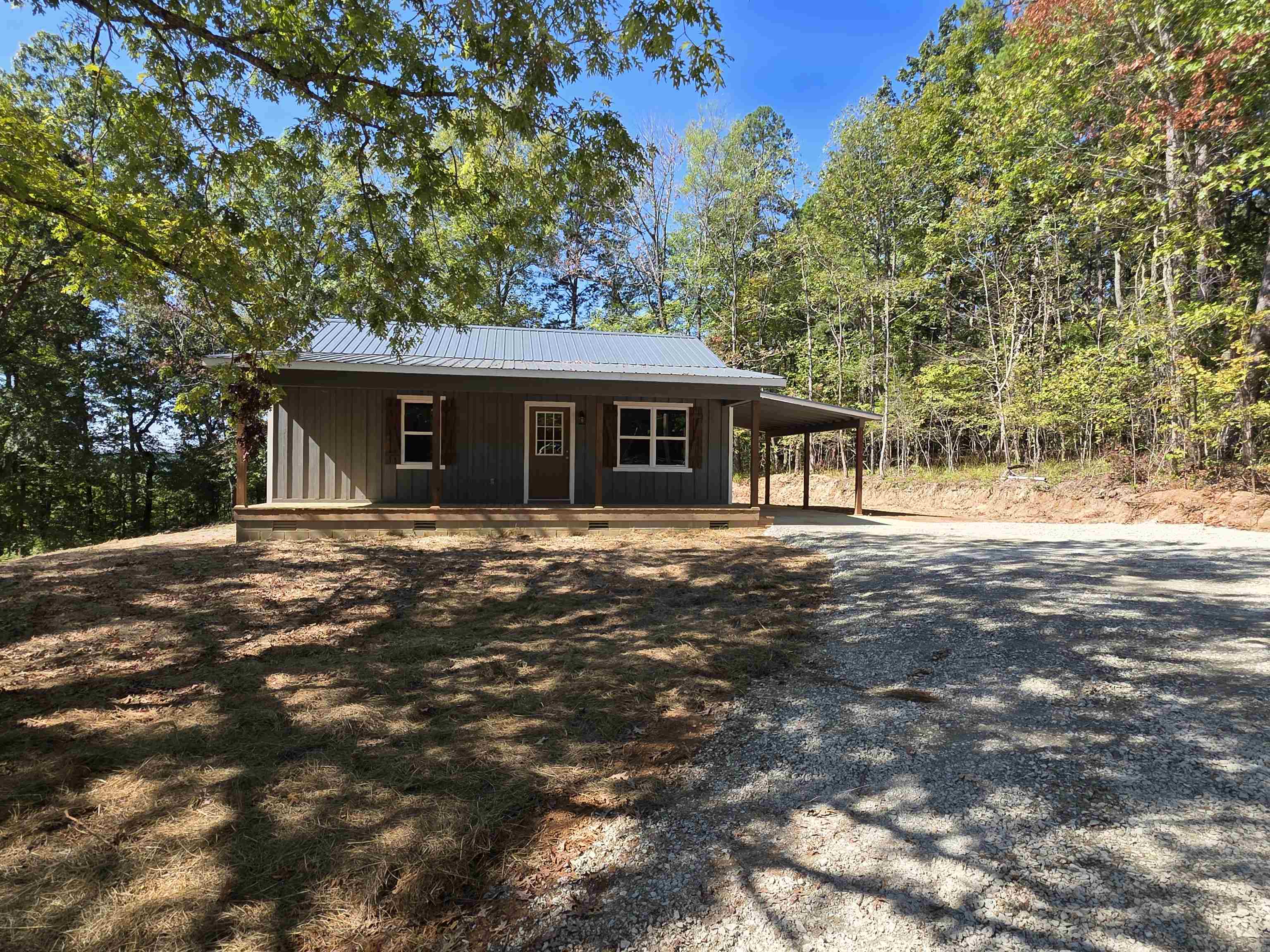 1020 Jade Road Savannah, TN 38372 - Photo 13 of 16 a front view of a house with a garden
