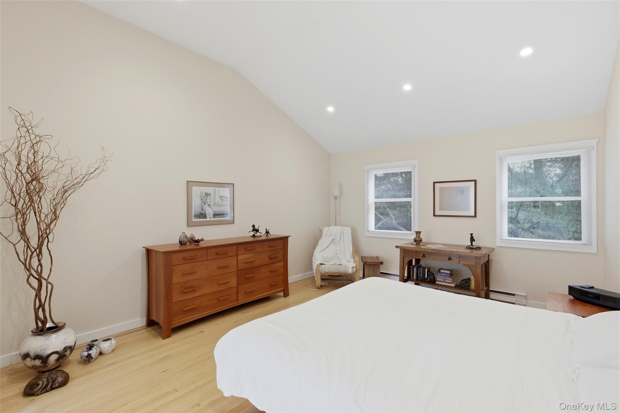 7 Gun Path Setauket, NY 11733 - Photo 18 of 34 a bed room with a bed and dresser