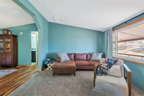 a living room with furniture and a table
