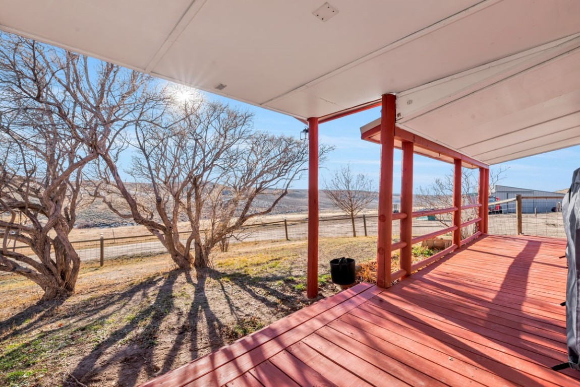 2005 County Road 207 Craig, CO 81625 - Photo 8 of 38 a balcony view with a large window and outdoor seating