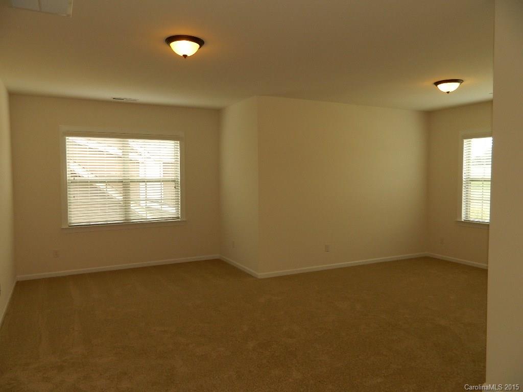 574 Brookhaven Drive, Unit HKC90 Fort Mill, SC 29708 - Photo 4 of 7 an empty room with a empty space and windows