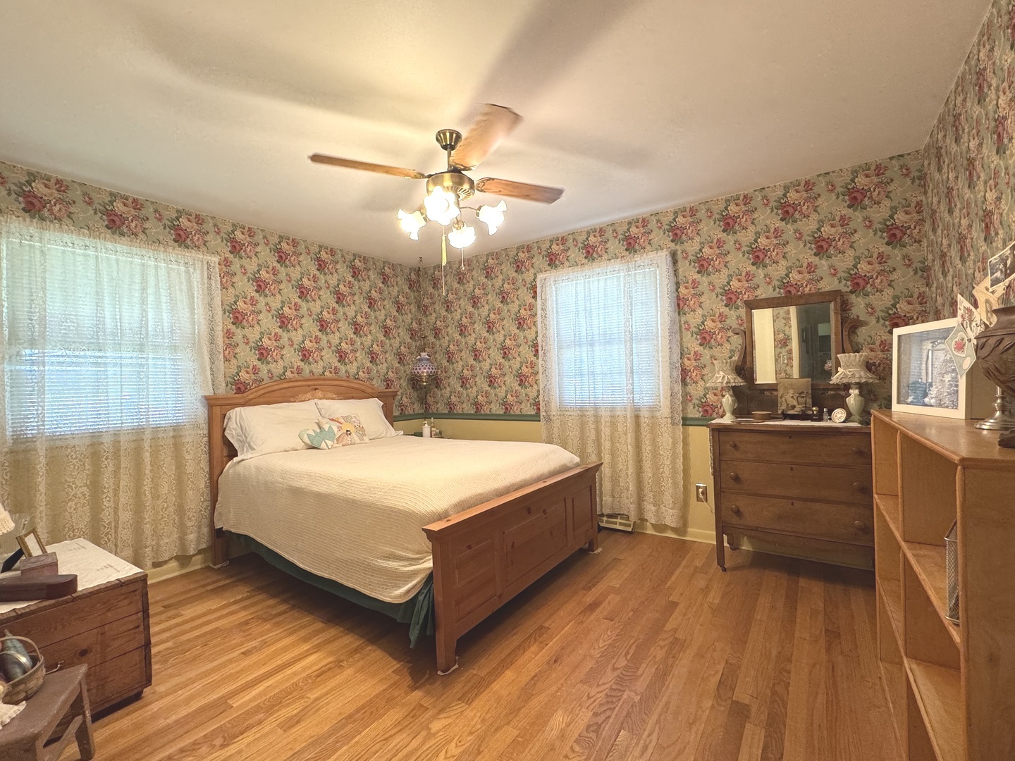 1442 West Budd Boulevard Kankakee, IL 60901 - Photo 11 of 27 a spacious bedroom with a bed and a chandelier