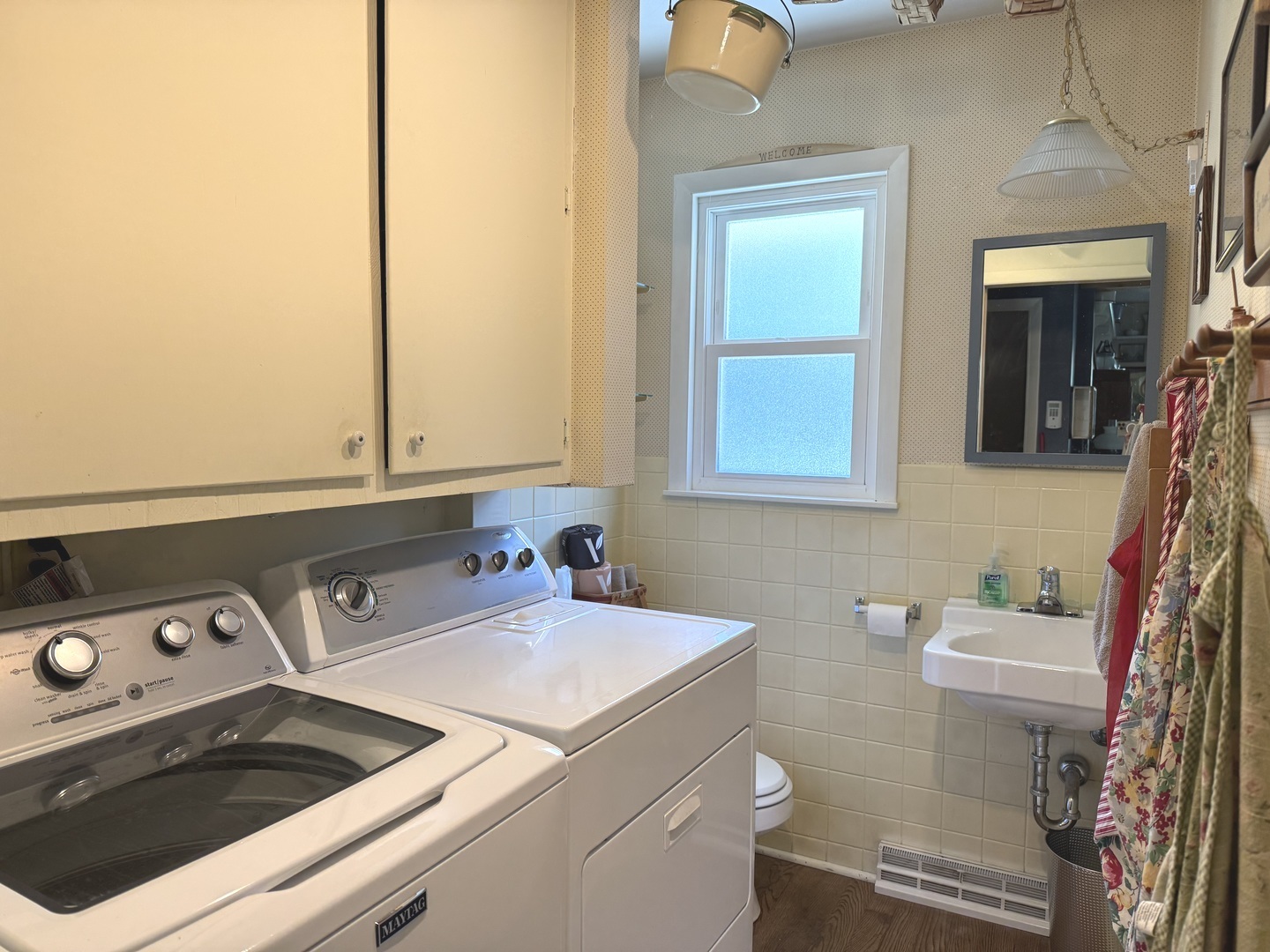 1442 West Budd Boulevard Kankakee, IL 60901 - Photo 17 of 27 a bathroom with a sink and a toilet