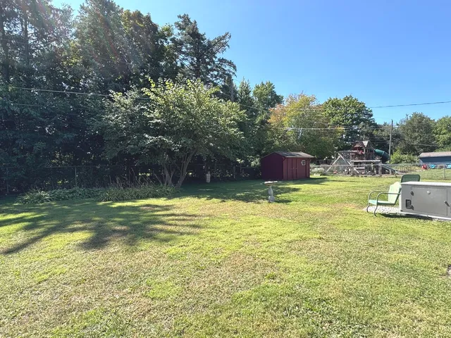 a view of a swimming pool with a yard