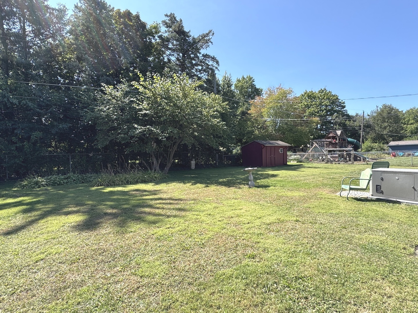 1442 West Budd Boulevard Kankakee, IL 60901 - Photo 20 of 27 a view of a swimming pool with a yard