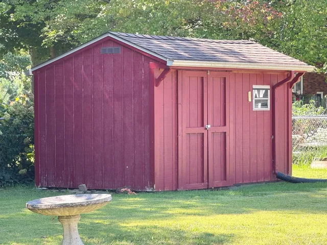 a view of barn with a small yard