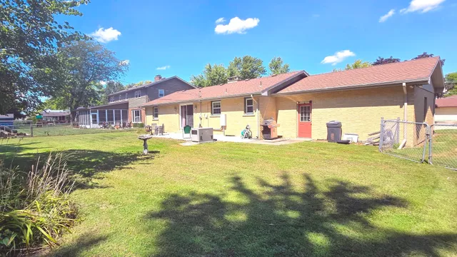 a view of a house with a yard