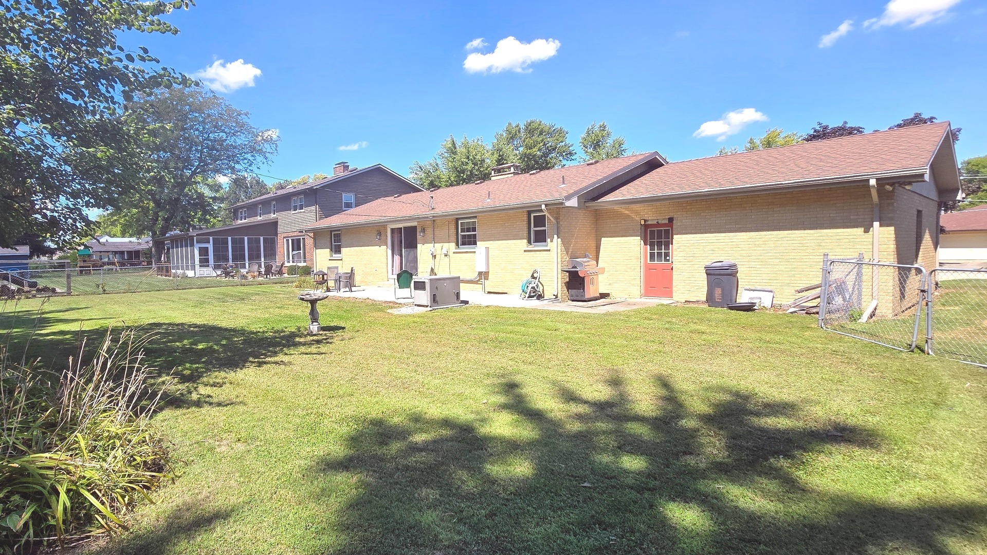 1442 West Budd Boulevard Kankakee, IL 60901 - Photo 25 of 27 a view of a house with a yard