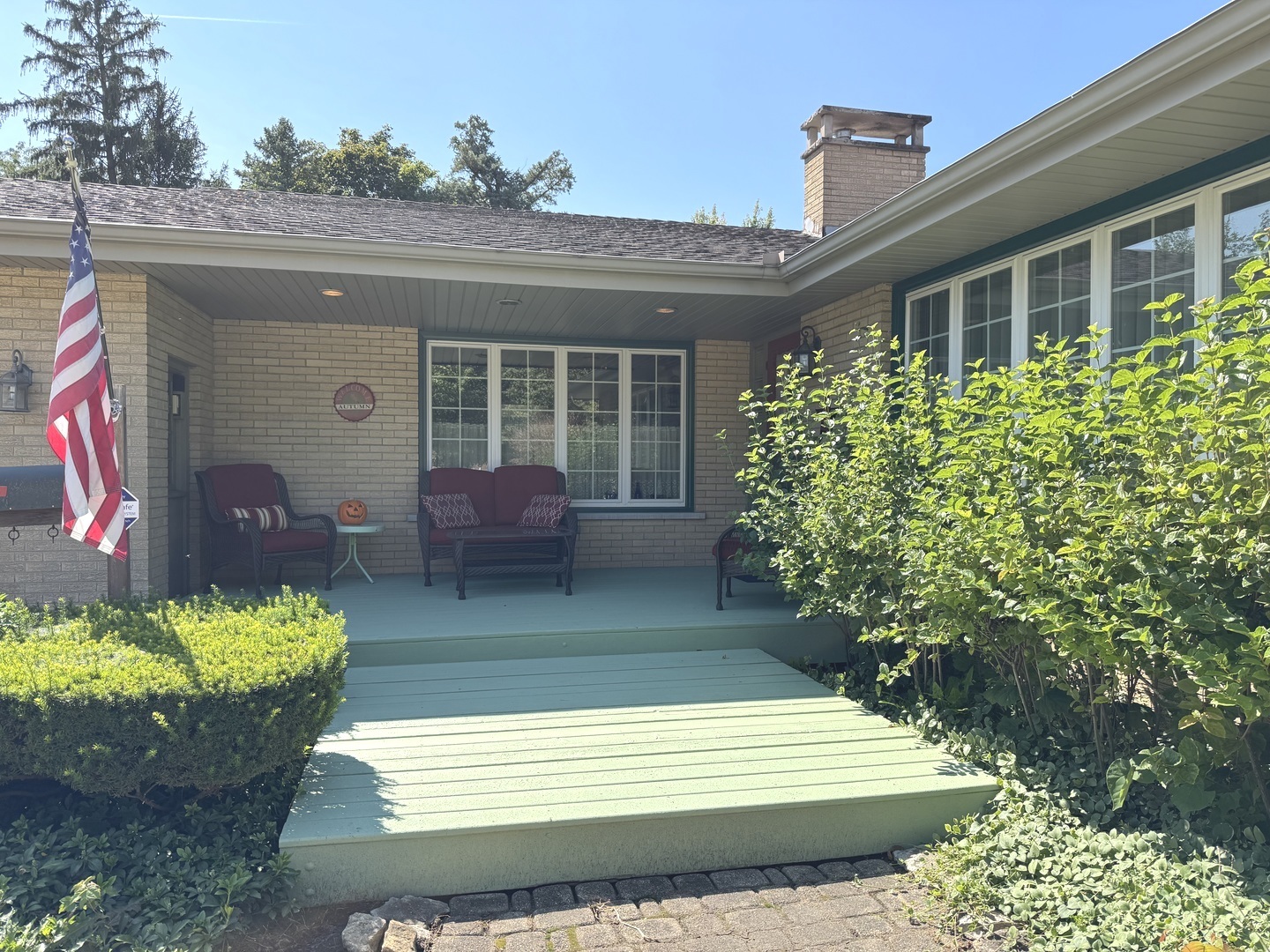 1442 West Budd Boulevard Kankakee, IL 60901 - Photo 3 of 27 a view of a house with a yard and potted plants