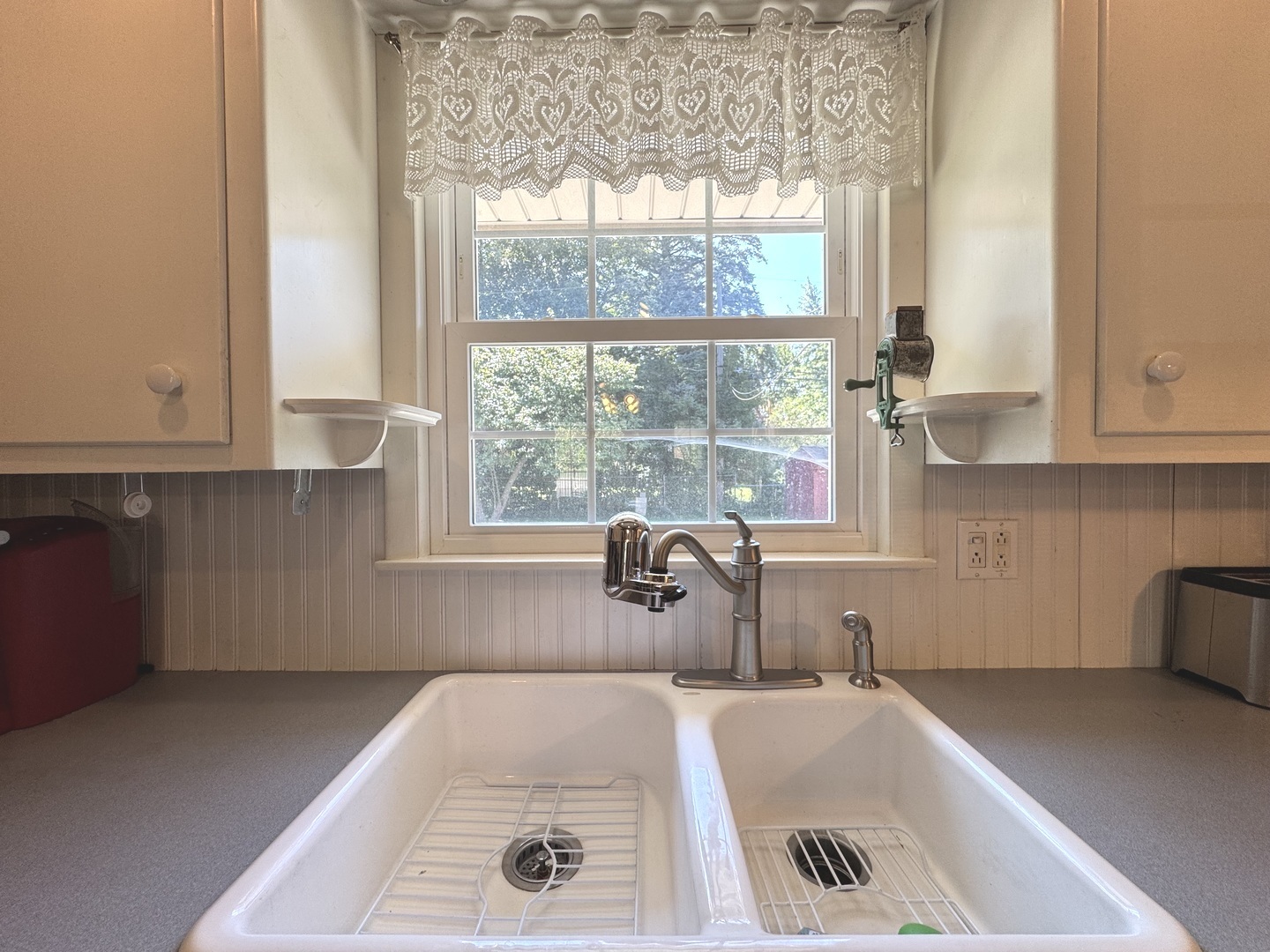 1442 West Budd Boulevard Kankakee, IL 60901 - Photo 7 of 27 a bath tub sitting in a bathroom next to a window