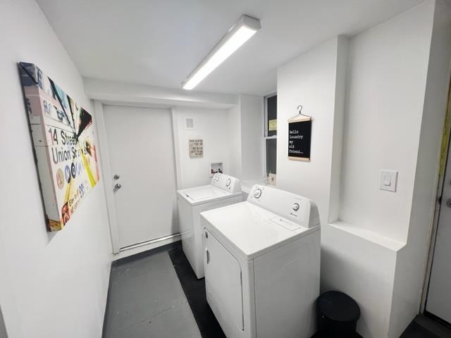 128 69th Street, Unit 1 Guttenberg, NJ 07093 - Photo 14 of 14 a utility room with dryer and washer