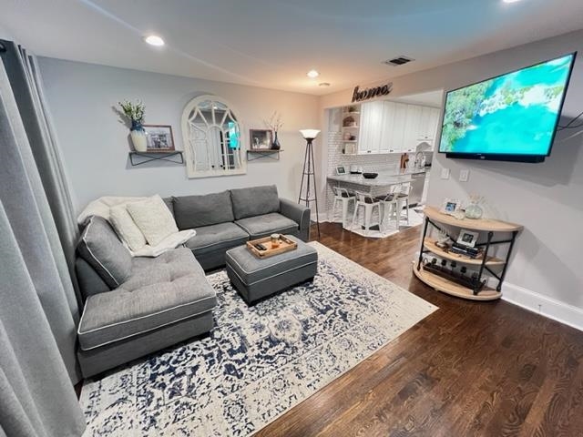 128 69th Street, Unit 1 Guttenberg, NJ 07093 - Photo 2 of 14 a living room with furniture and a flat screen tv