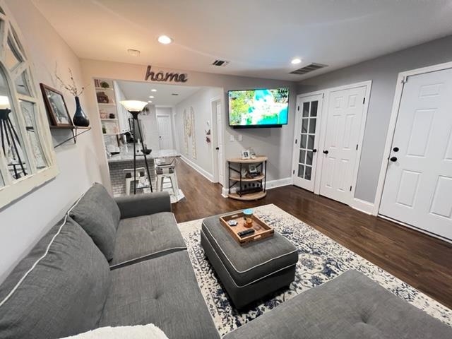 128 69th Street, Unit 1 Guttenberg, NJ 07093 - Photo 4 of 14 a living room with furniture and a flat screen tv