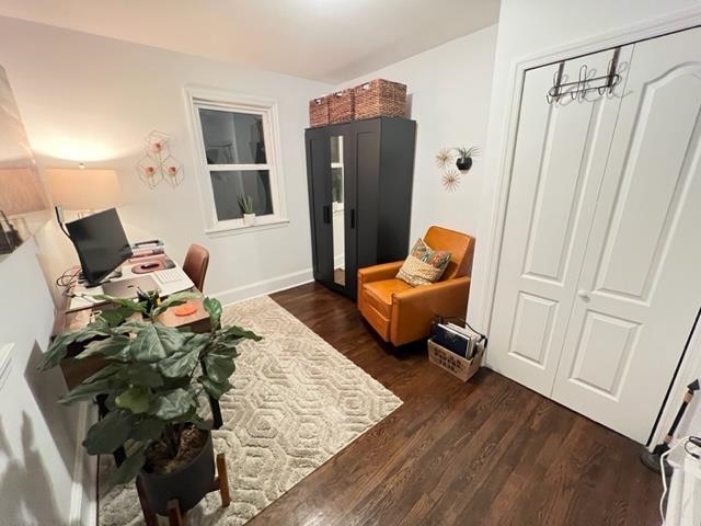128 69th Street, Unit 1 Guttenberg, NJ 07093 - Photo 10 of 14 a living room with furniture and a wooden floor