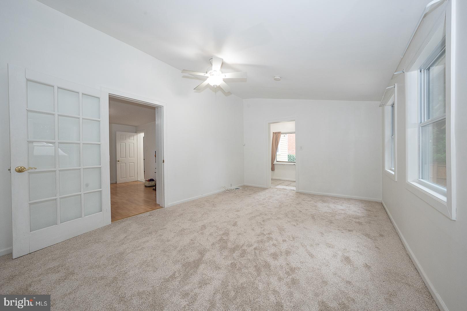 332 Old Lancaster Road Devon, PA 19333 - Photo 11 of 28 an empty room with windows and entrance
