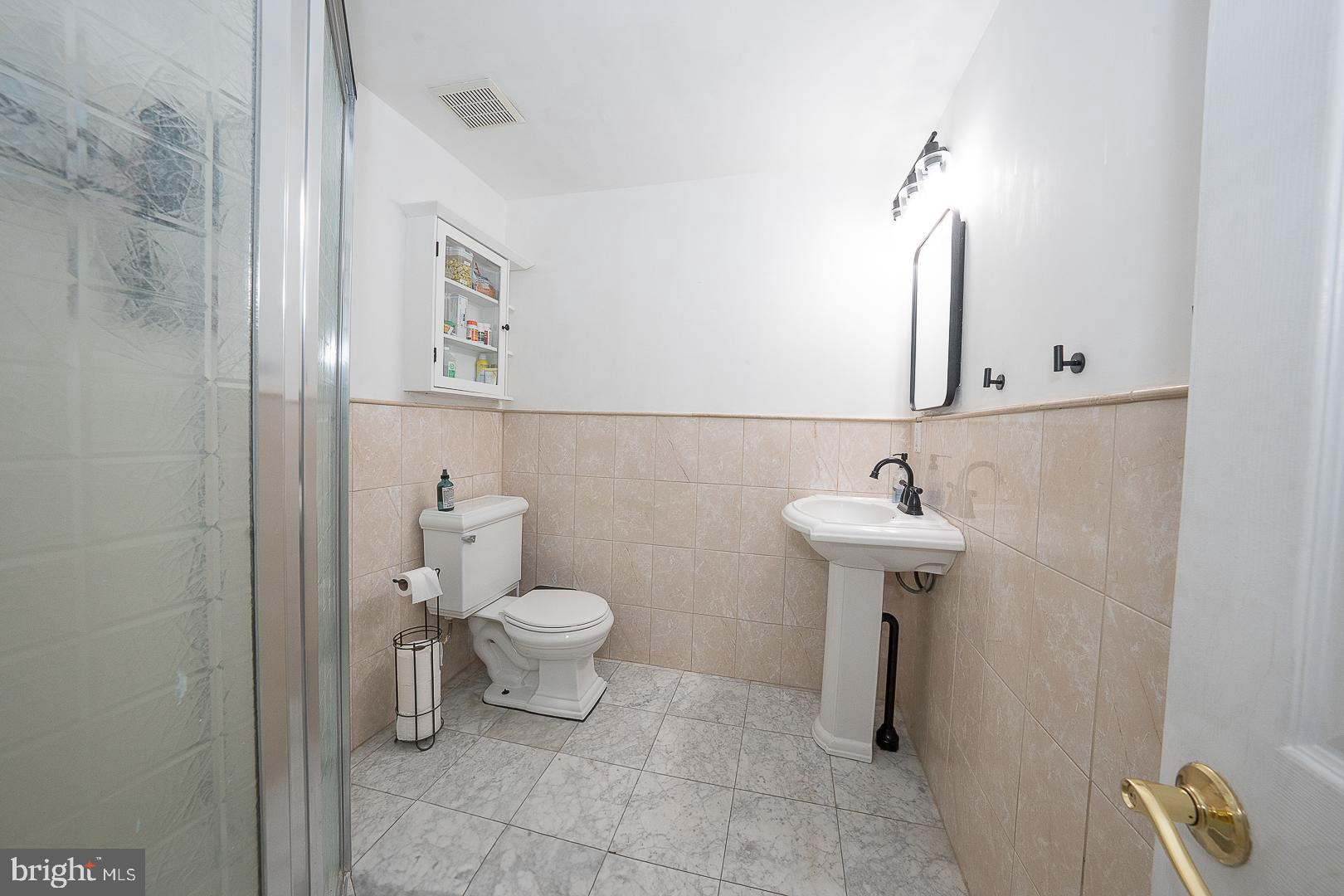 332 Old Lancaster Road Devon, PA 19333 - Photo 14 of 28 a bathroom with a sink toilet and a mirror