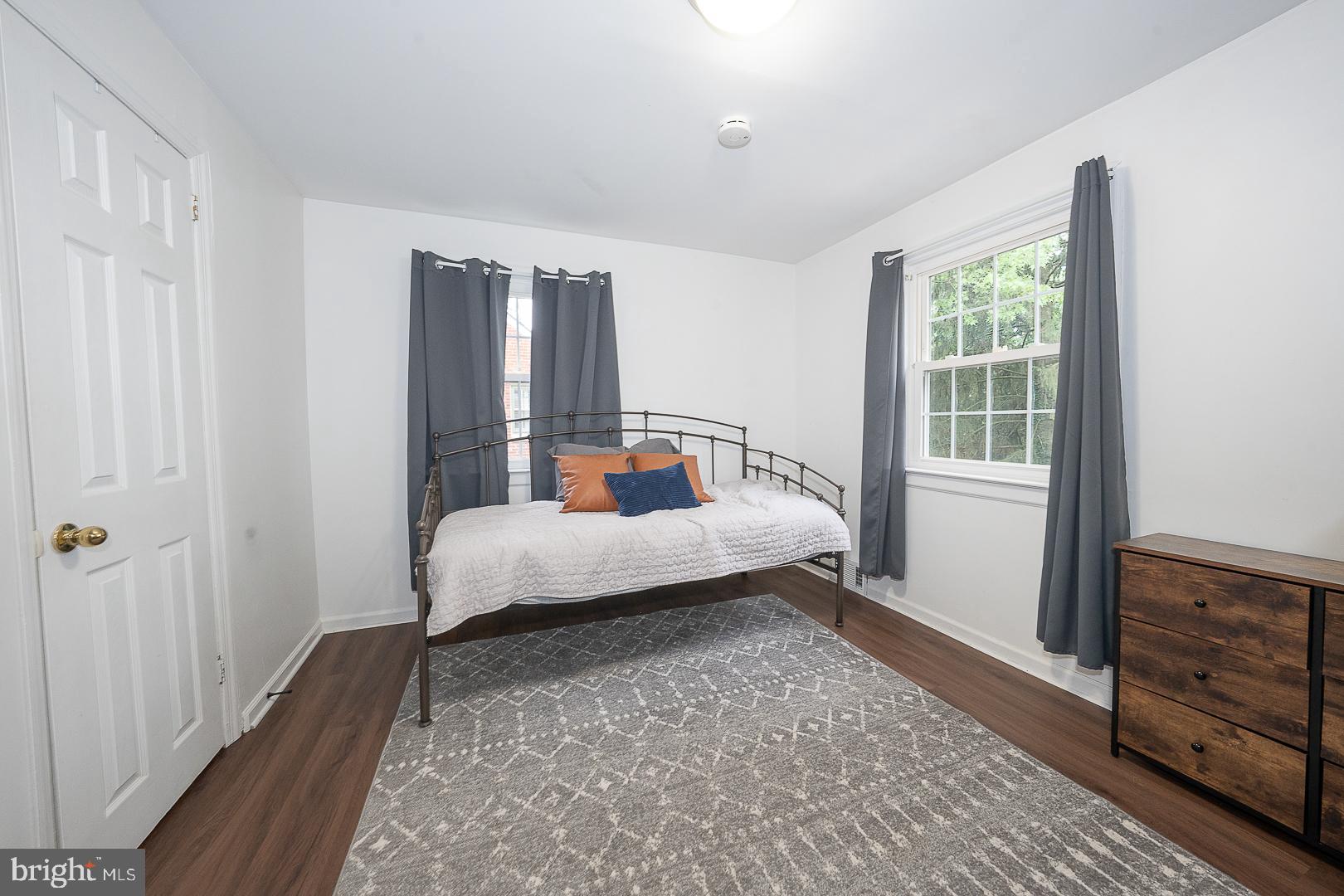 332 Old Lancaster Road Devon, PA 19333 - Photo 19 of 28 a bedroom with a bed and wooden floor