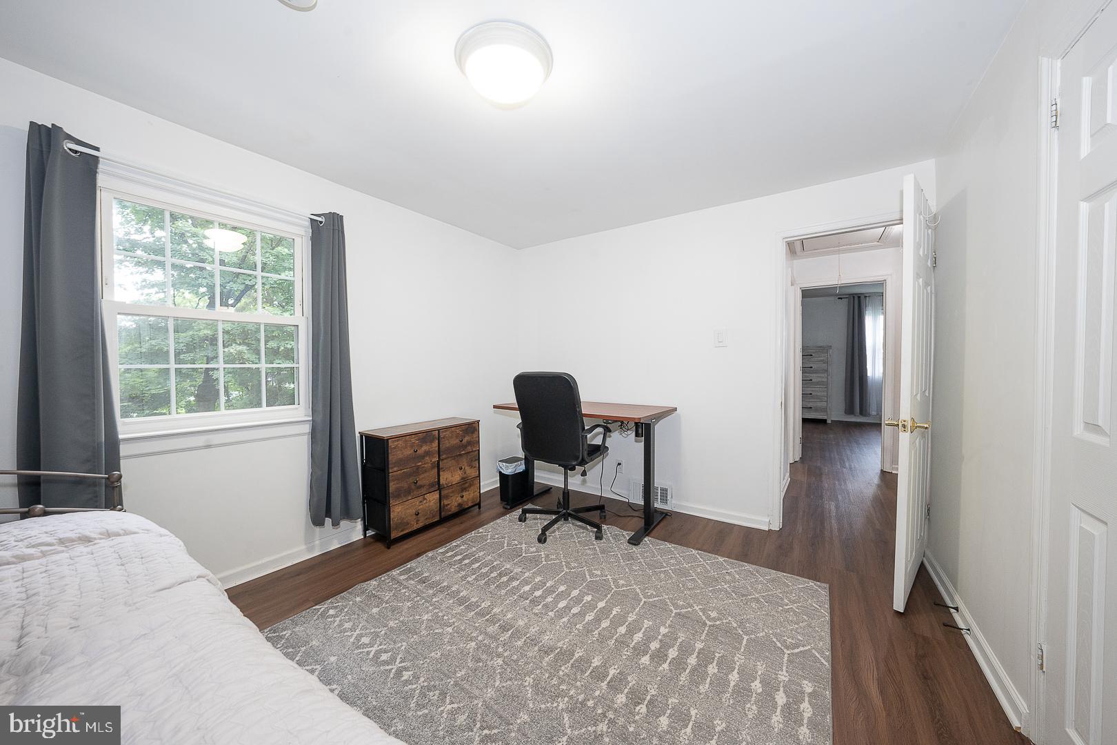 332 Old Lancaster Road Devon, PA 19333 - Photo 20 of 28 a bed room with a bed and a chair
