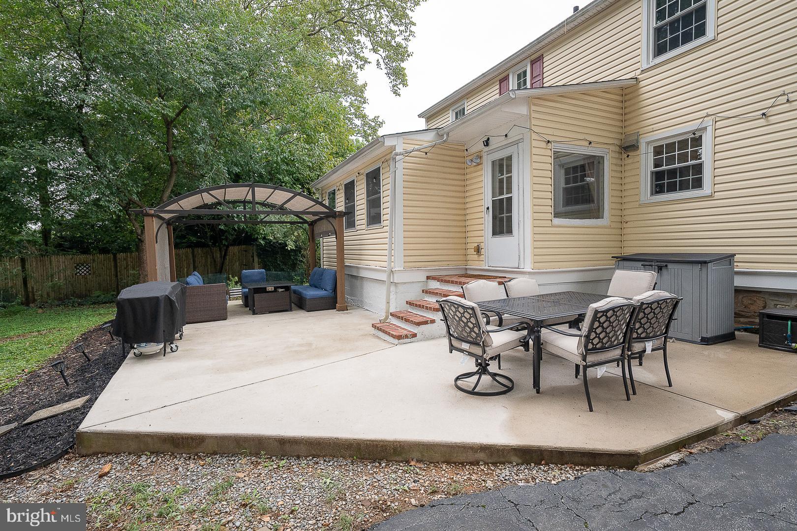 332 Old Lancaster Road Devon, PA 19333 - Photo 23 of 28 a view of a patio with table and chairs under an umbrella