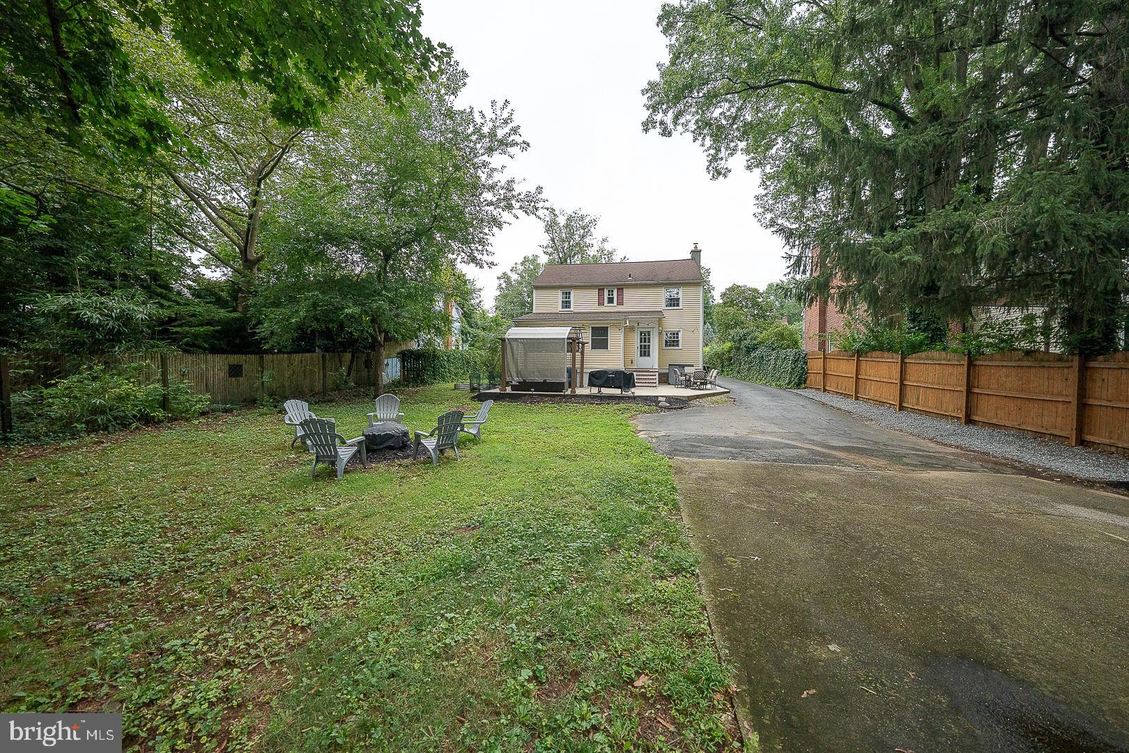 332 Old Lancaster Road Devon, PA 19333 - Photo 25 of 28 a view of a backyard with a table and chairs