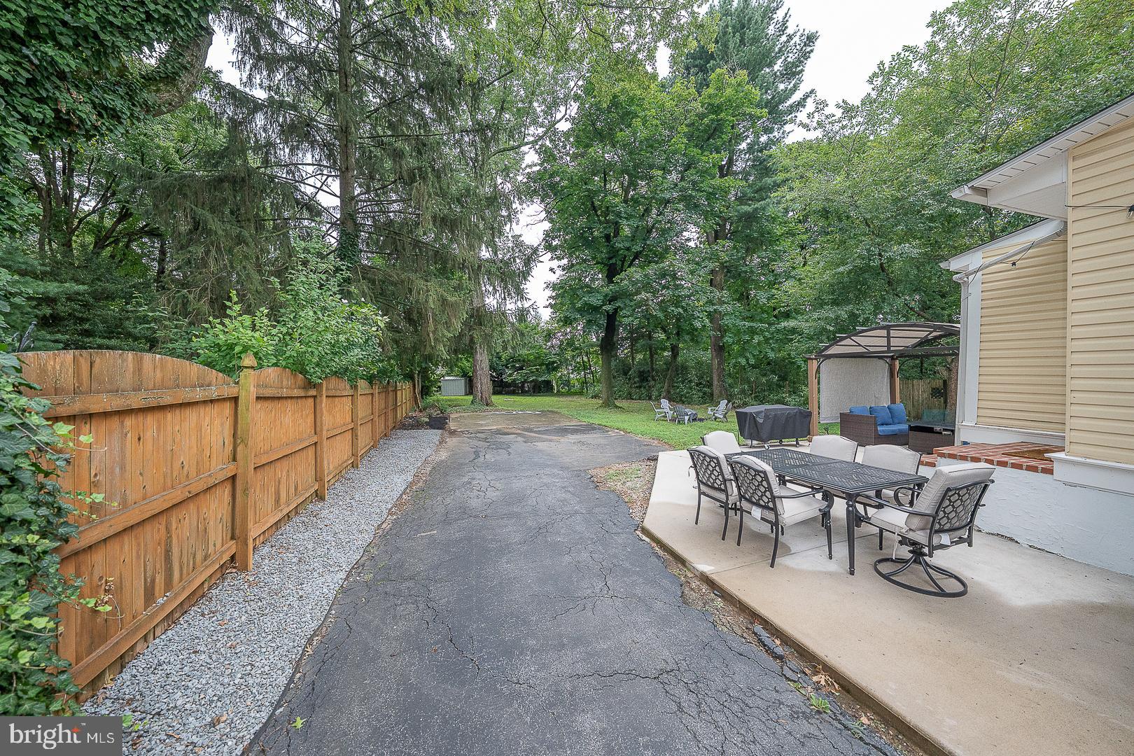 332 Old Lancaster Road Devon, PA 19333 - Photo 26 of 28 a view of a patio with a table and chairs