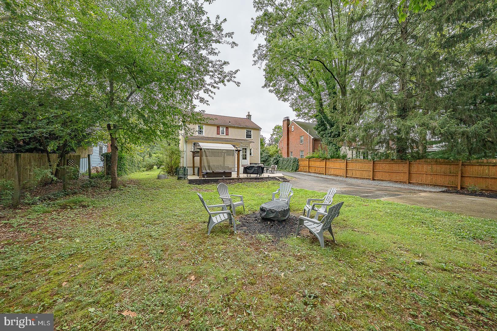 332 Old Lancaster Road Devon, PA 19333 - Photo 27 of 28 a view of a backyard with table and chairs