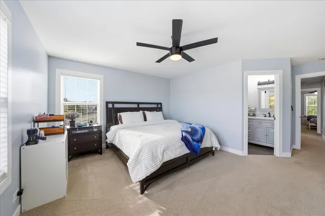 a bedroom with a bed and dresser