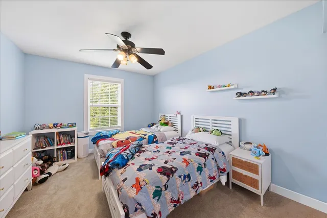 a bedroom with bed and a window