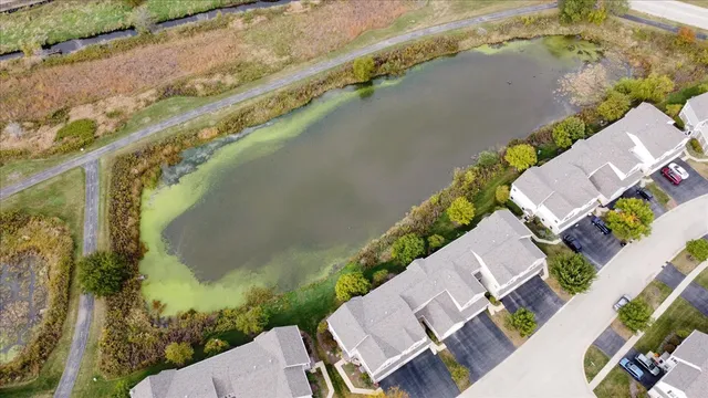 an aerial view of a residential houses with outdoor space