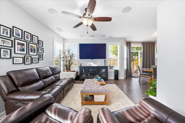 a living room with furniture fireplace and a flat screen tv