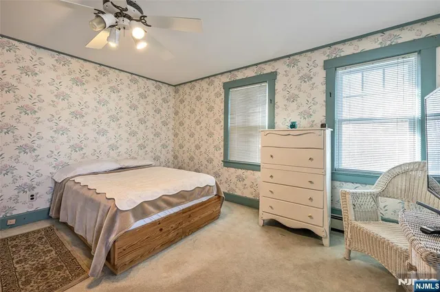 a bedroom with a bed and a cabinets