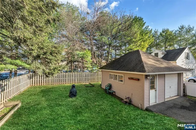 a view of a house with a yard and deck