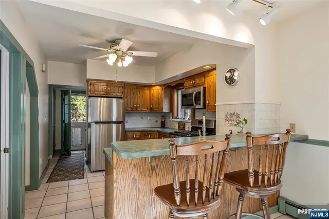 a kitchen with a table and chairs