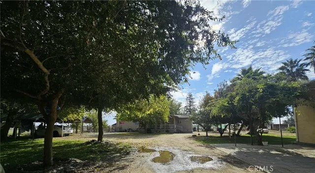 a view of a livingroom with furniture and staircase