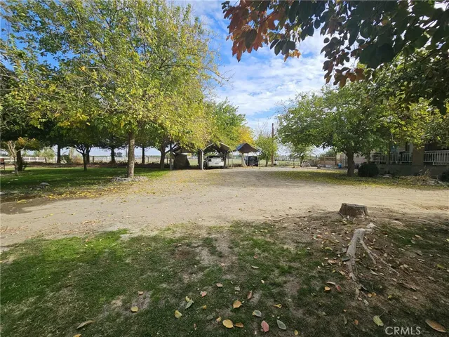 a view of a backyard with sitting area