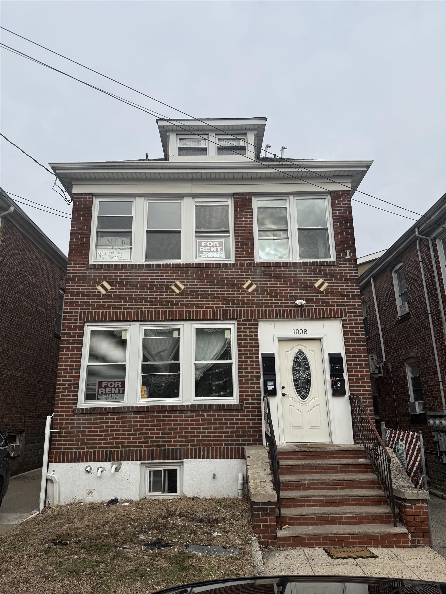 a front view of a house with a balcony