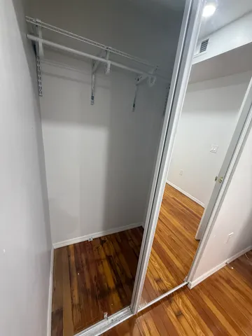 a view of an empty walk in closet