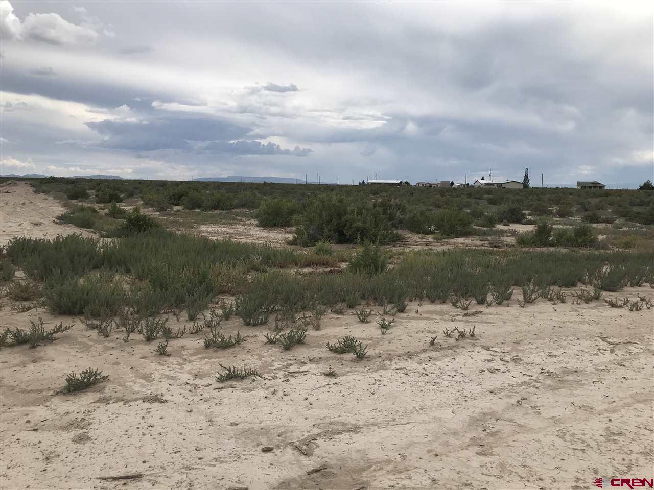 Undisclosed Address Alamosa, CO 81101 - Photo 6 of 19 Corner of Lot from Mountain View Blvd with Bob-O-Link running on Left of property.