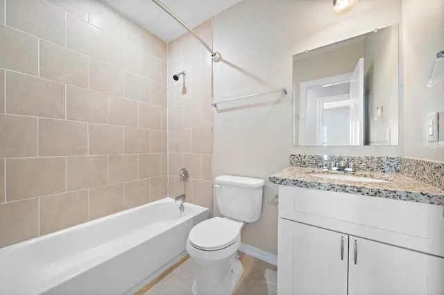 a bathroom with a sink a toilet and a bathtub