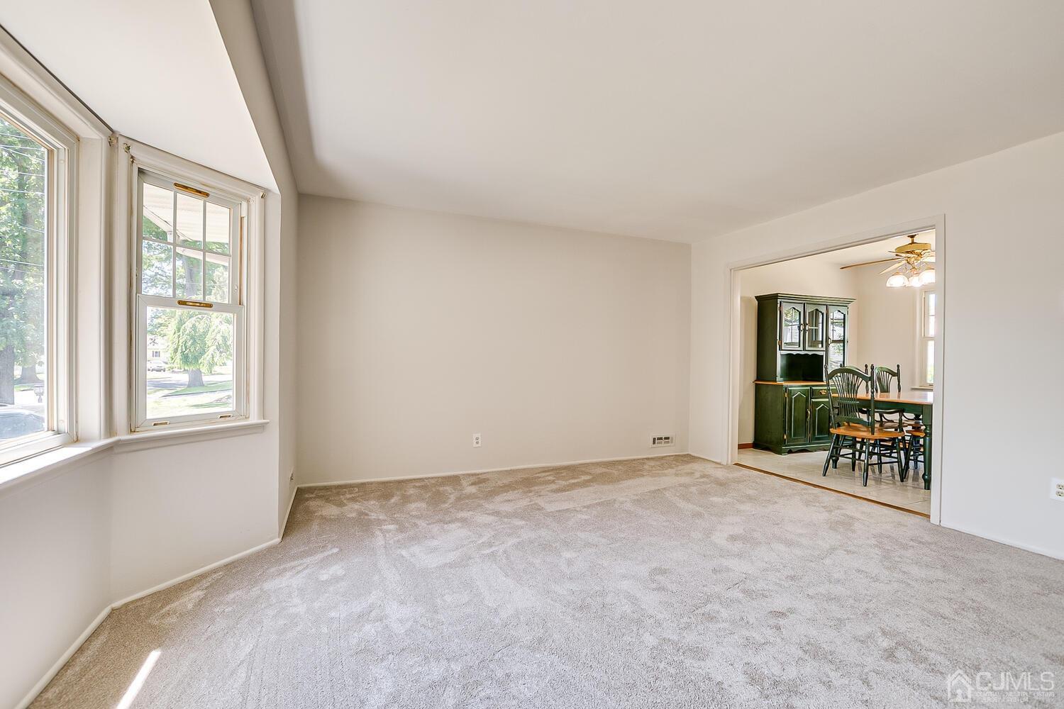 8 Meyer Road Edison, NJ 08817 - Photo 12 of 47 an empty room with furniture and a window