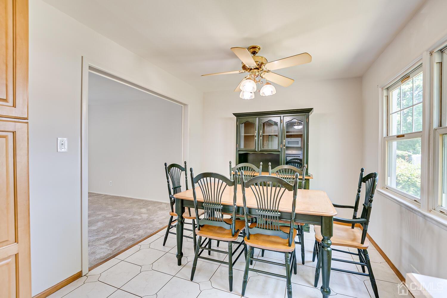 8 Meyer Road Edison, NJ 08817 - Photo 20 of 47 a view of a dining room with furniture window and wooden floor