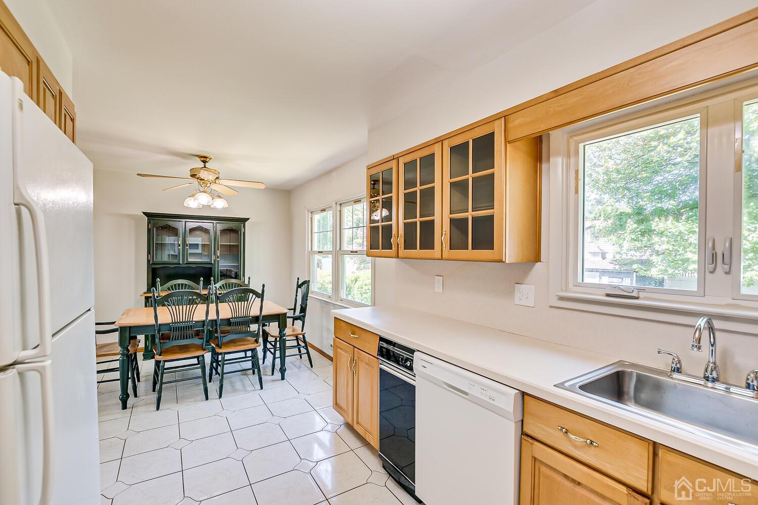 8 Meyer Road Edison, NJ 08817 - Photo 23 of 47 a kitchen with stainless steel appliances granite countertop sink stove top oven and cabinets