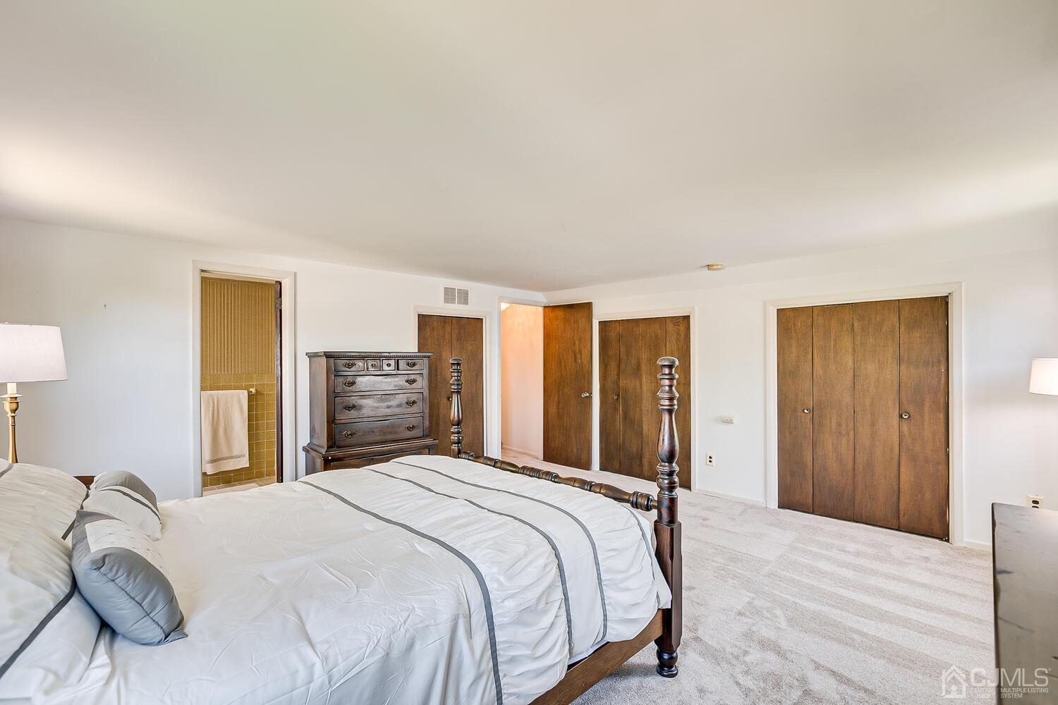 8 Meyer Road Edison, NJ 08817 - Photo 29 of 47 a bedroom with a large bed and a dresser