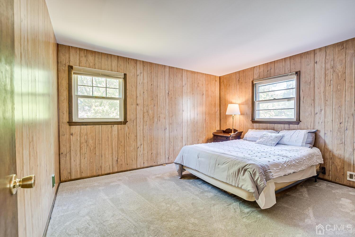8 Meyer Road Edison, NJ 08817 - Photo 31 of 47 a bedroom with a bed lamp and a window