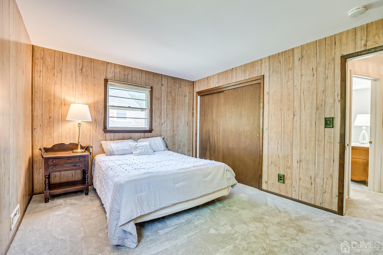 8 Meyer Road Edison, NJ 08817 - Photo 32 of 47 a bedroom with a bed and a table in it