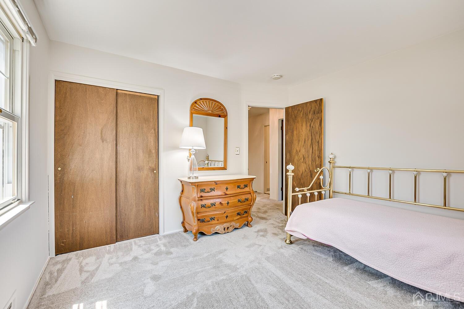 8 Meyer Road Edison, NJ 08817 - Photo 37 of 47 a bedroom with a bed and wooden floor