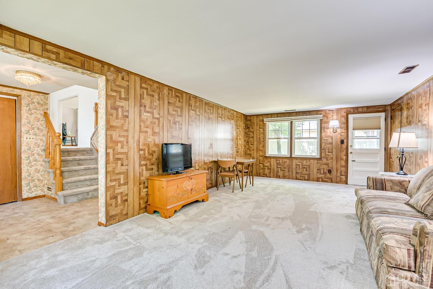 8 Meyer Road Edison, NJ 08817 - Photo 7 of 47 a living room with furniture large window and flat screen tv