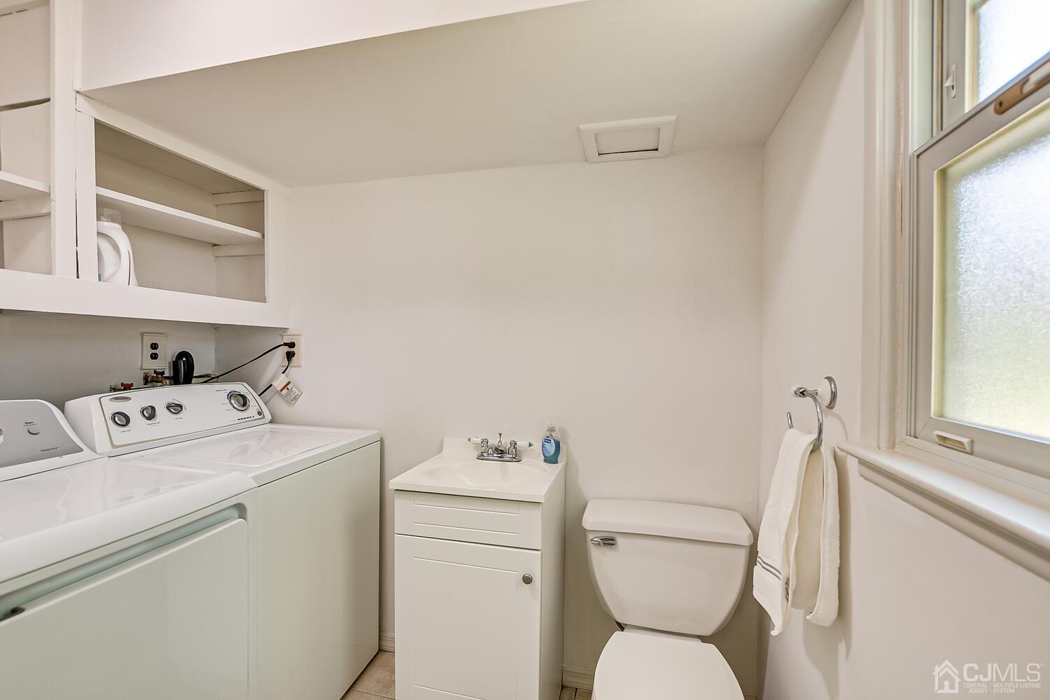 8 Meyer Road Edison, NJ 08817 - Photo 9 of 47 a bathroom with a toilet and a sink