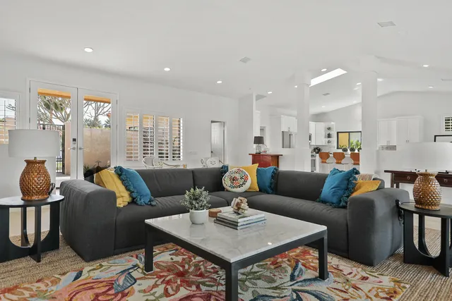 a living room with furniture and a rug