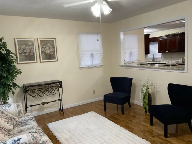 a living room with furniture and a chair